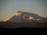 01 Gurla Mandhata Sunrise From Darchen At Beginning Of Kailash Outer Kora Gurla Mandhata (7728m) shines in the first light of sunrise seen from Darchen. Gurla Mandhata was first climbed by a Chinese-Japanese Expedition under climbing leader Katsutoshi Hirabayashi with eight climbers reaching the top on May 26, 1987 and another five climbers reaching the summit the next day.